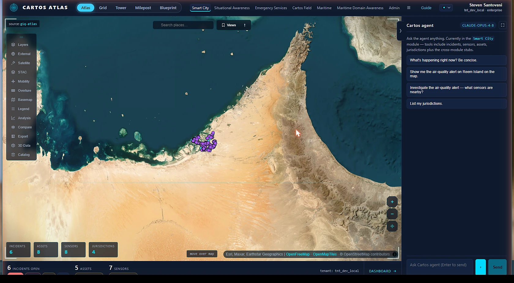 Cartos Atlas — Smart City operations over Abu Dhabi with the Cartos AI agent panel and the live KPI strip.