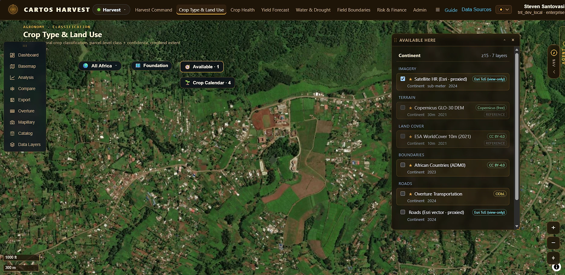 Cartos Harvest — Crop Type & Land Use over sub-metre satellite imagery of Kenyan smallholder fields, with the Available Here panel resolving seven candidate layers for the current scope and zoom.